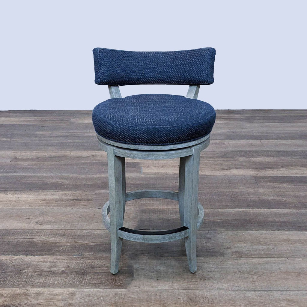 a pair of blue upholstered bar stools