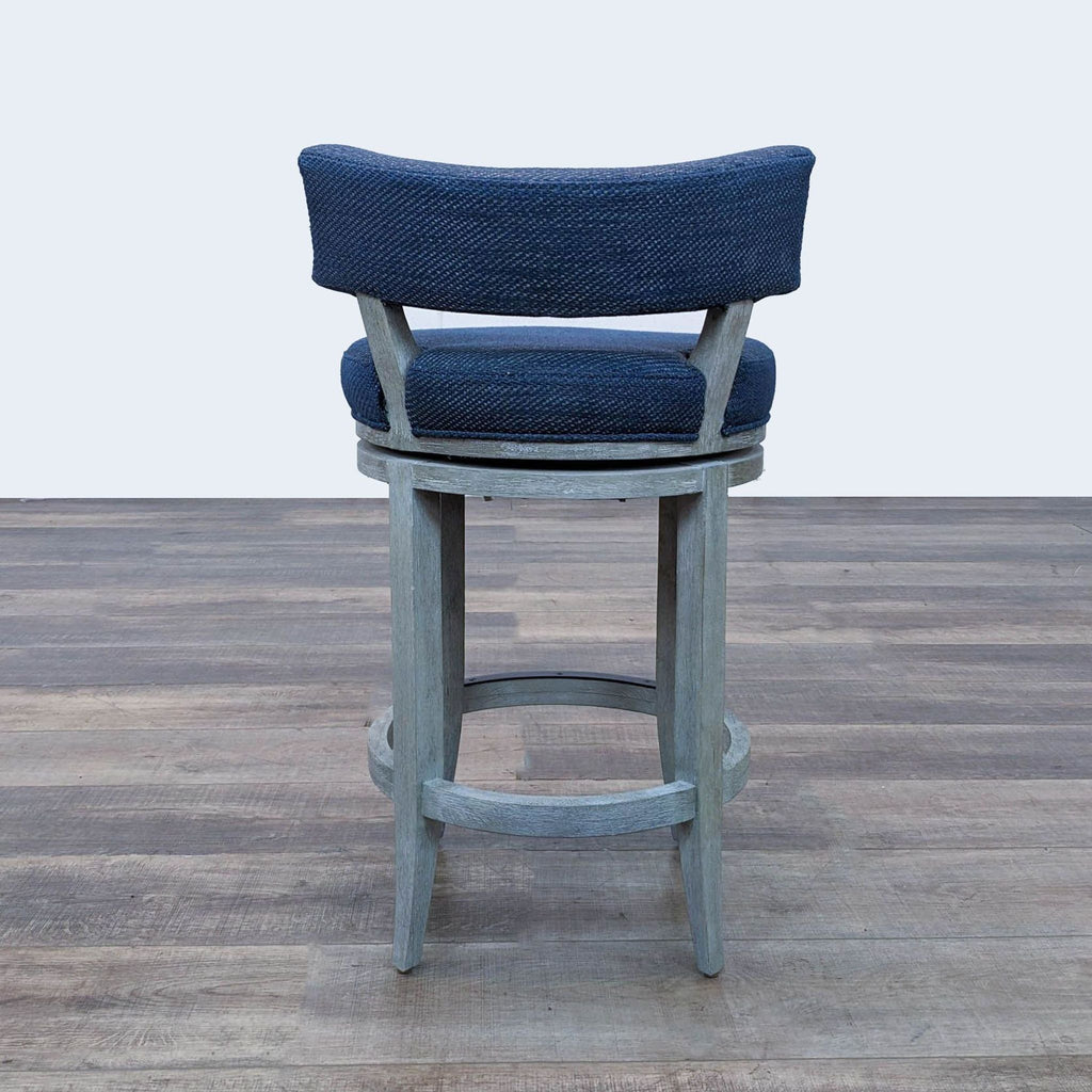 a pair of blue linen bar stools