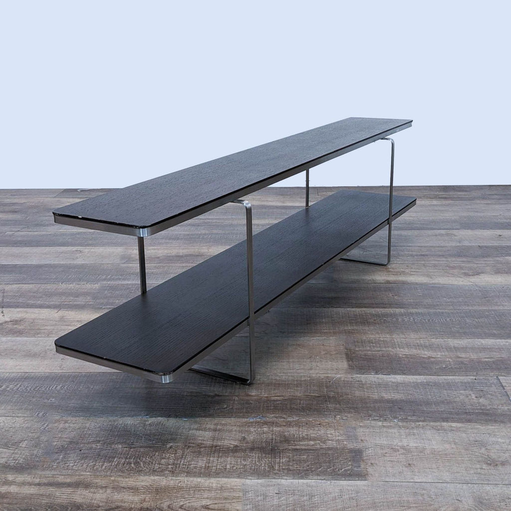 the table is made of a black lacquered wood with a black metal base.