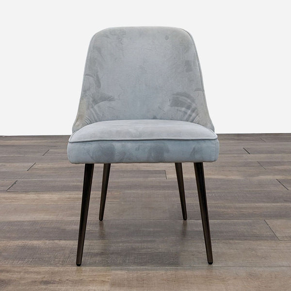 a chair with a blue velvet fabric