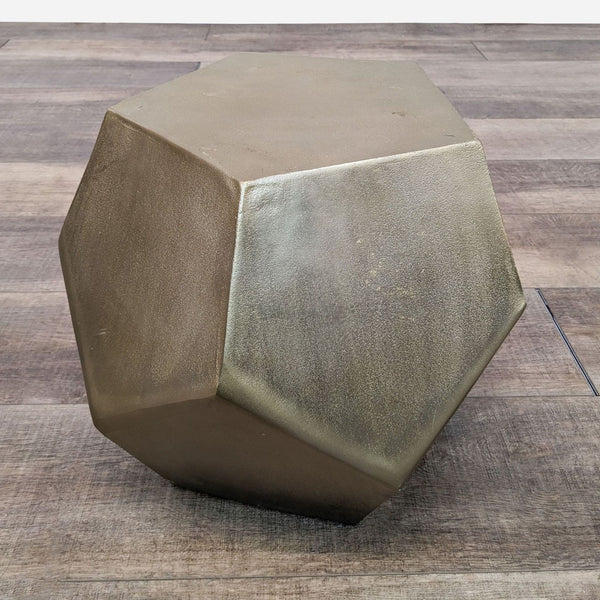 a large metal cube with a hexagon shape.