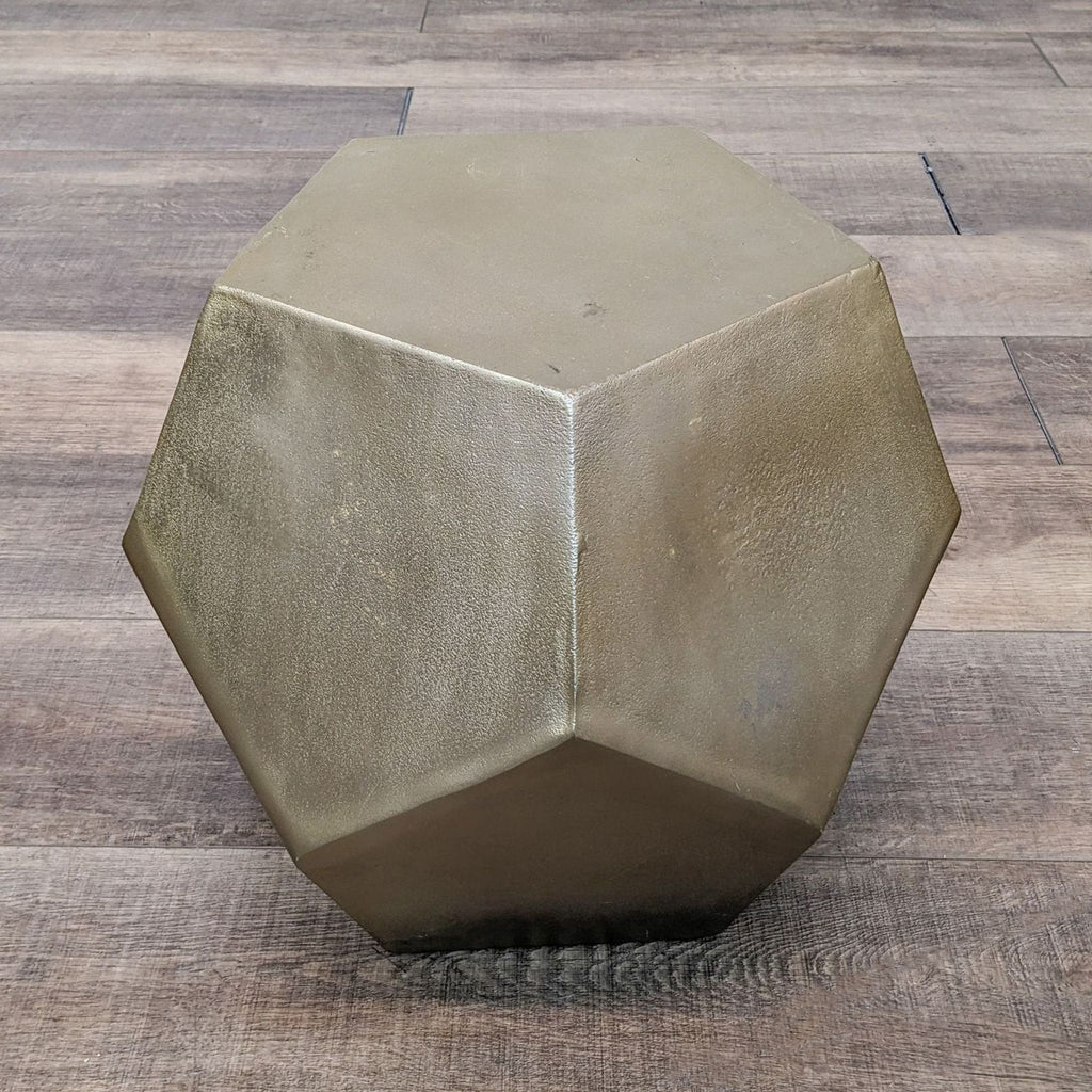 a large brass hexagon coffee table