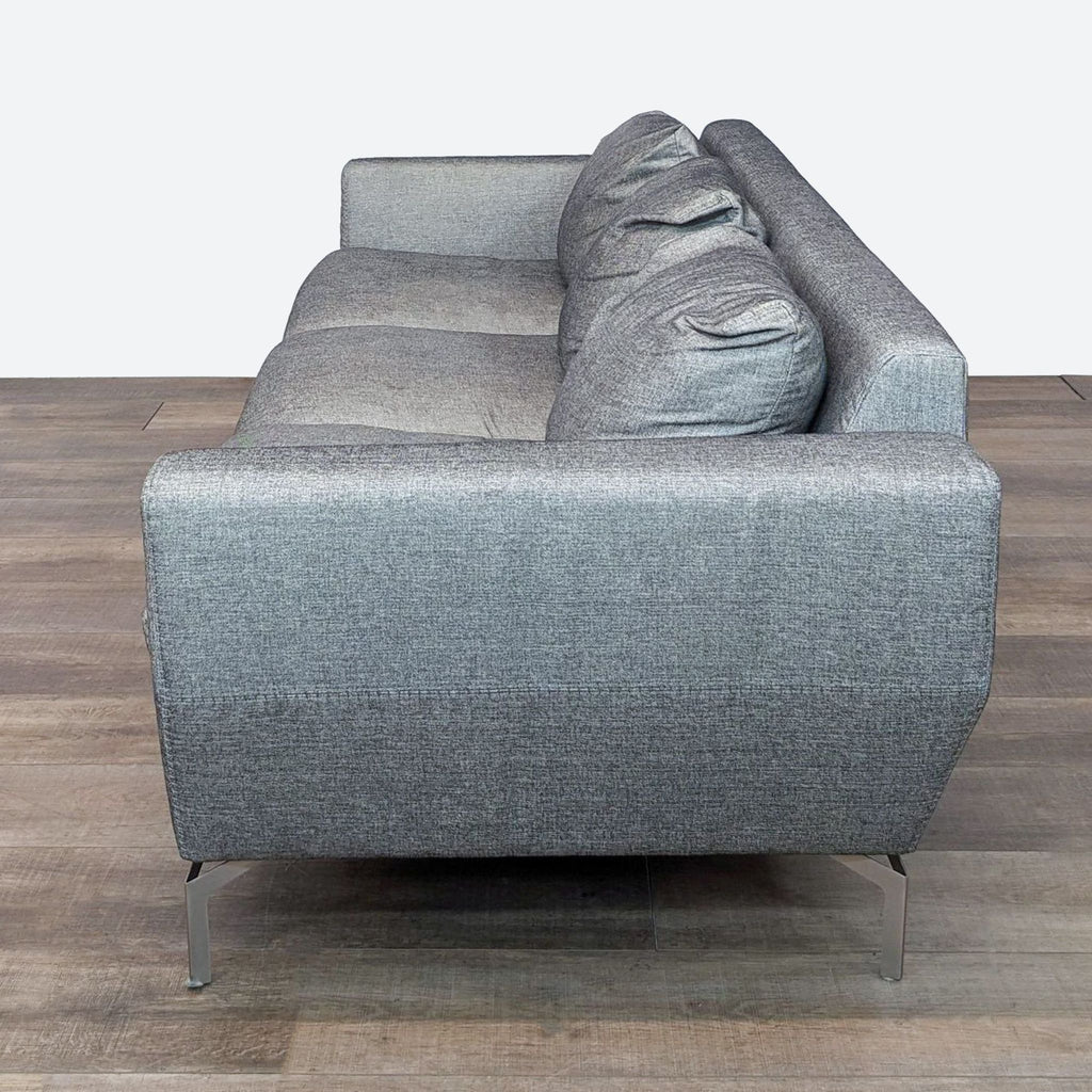 sofa is a modern sofa that is made from a single piece of fabric. the sofa is made