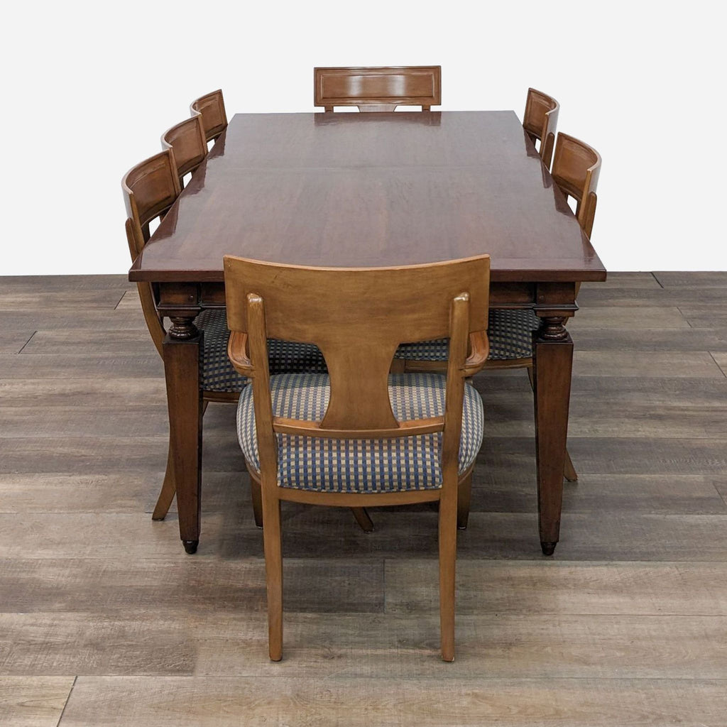 a set of six dining chairs and a table
