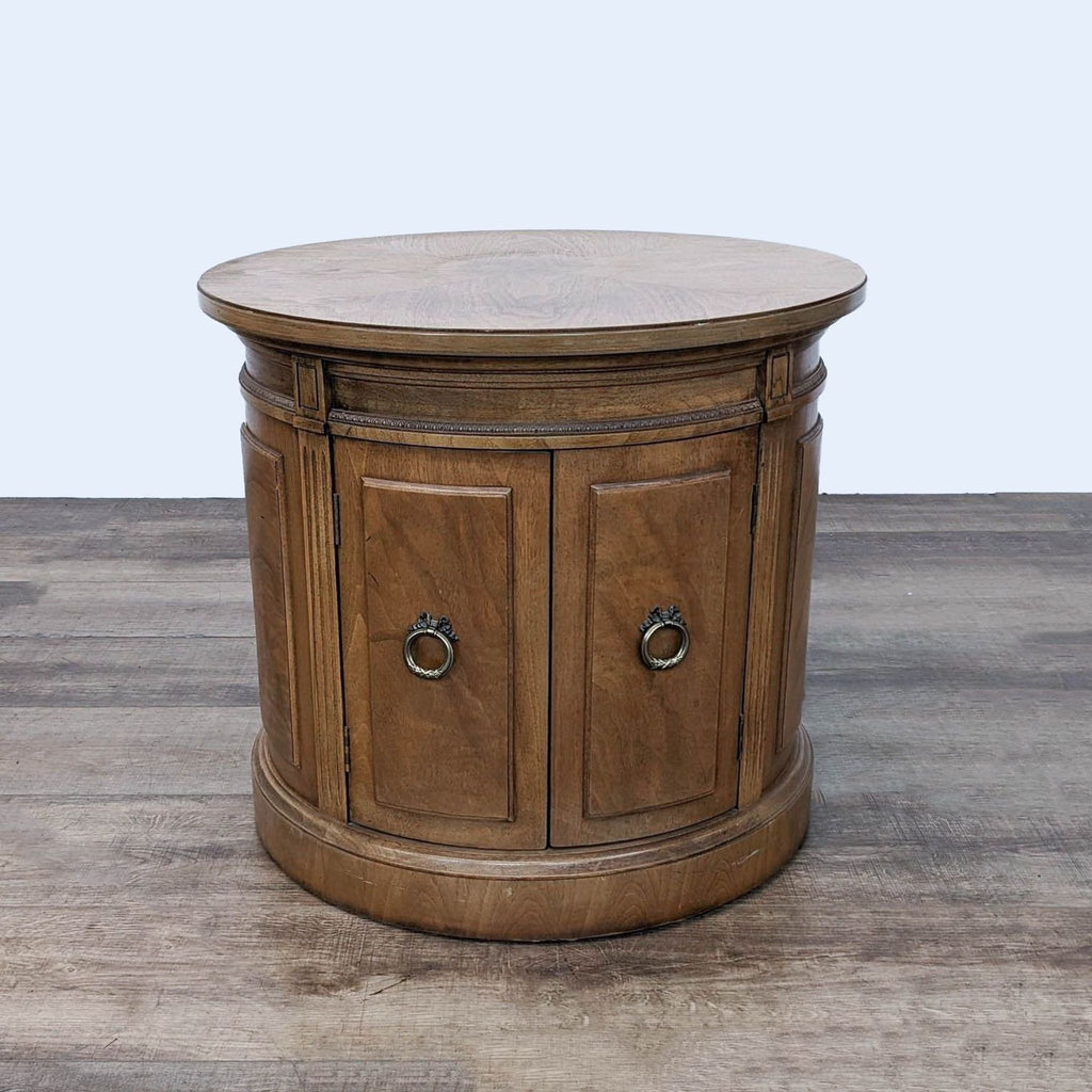 a round coffee table with a drawer and two drawers.