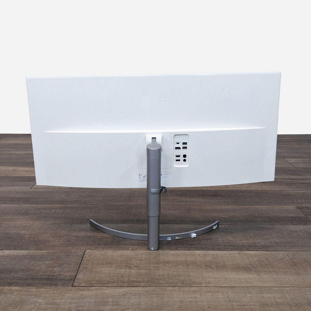 the back of the desk is a white metal frame with a metal base.