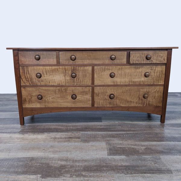 Stickley dresser with seven spacious drawers and unique wooden handles.