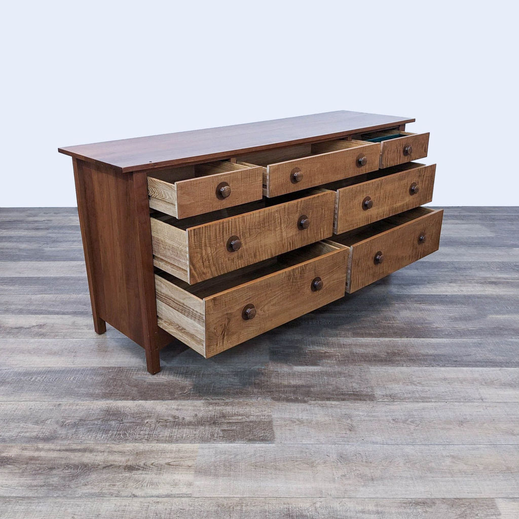 Side view of Stickley dresser showcasing open drawers and ample storage.