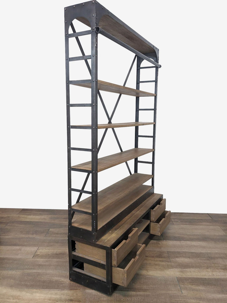 Side view of a Restoration Hardware iron and walnut bookshelf showing shelves and drawers in detail.