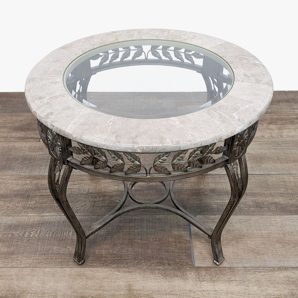 a large and decorative wrought iron coffee table with a glass top.