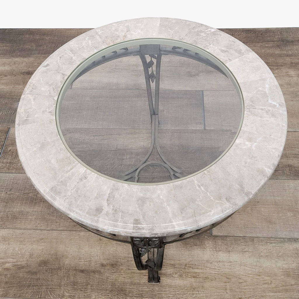 a round marble table with a glass top.