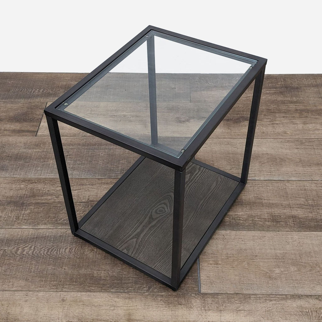 the glass top end table is a modern, contemporary design.