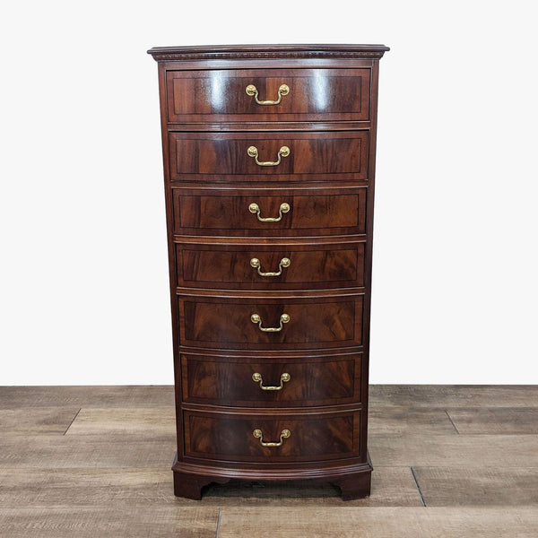 a mahogany chest of drawers with brass handles