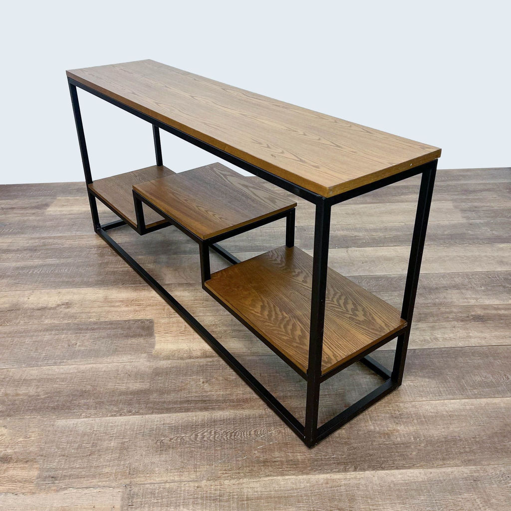 a modern industrial style metal and wood console table with a shelf