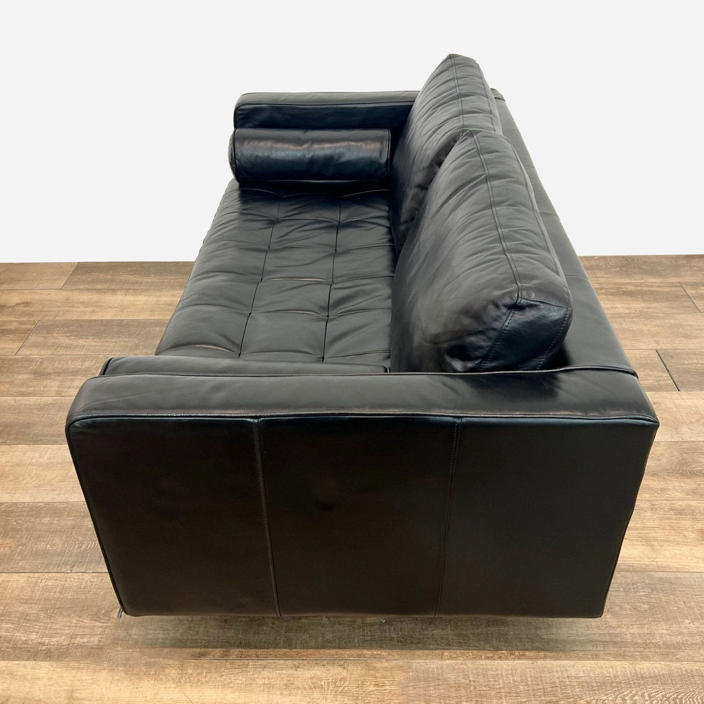 a leather sofa by [ unused0 ] for [ unused0 ]