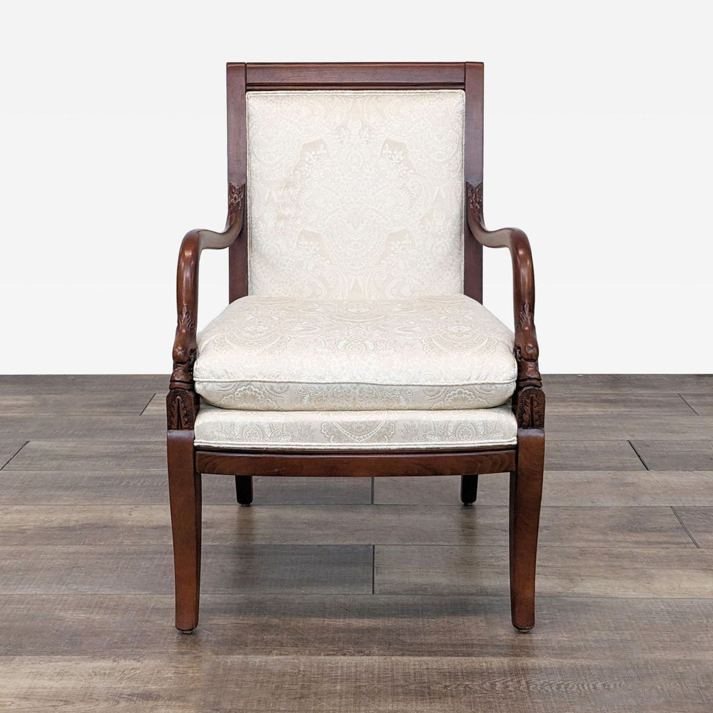 a pair of early 20th century mahogany and ivory wingback chairs