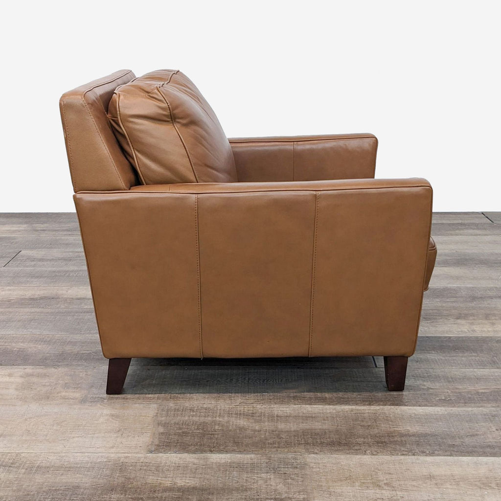 a brown leather chair and a brown leather chair