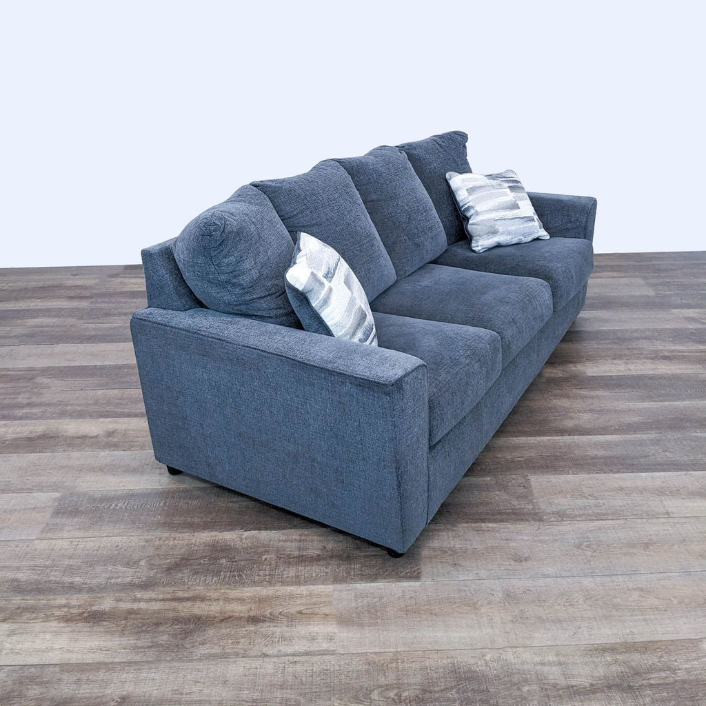 sofa is a modern sofa that is made of soft fabric and has a soft, comfortable design.