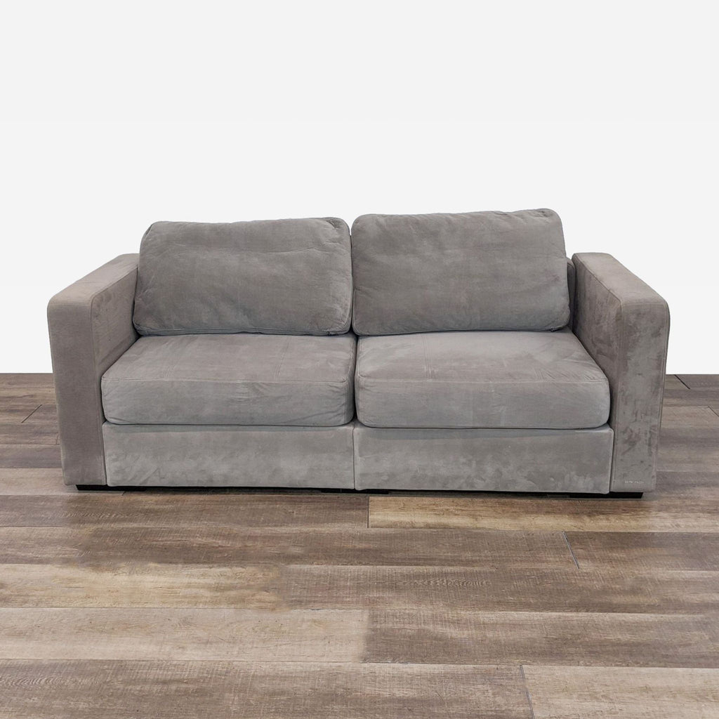 the [ unused0 ] sofa is a modern, contemporary sofa that is made from a soft grey