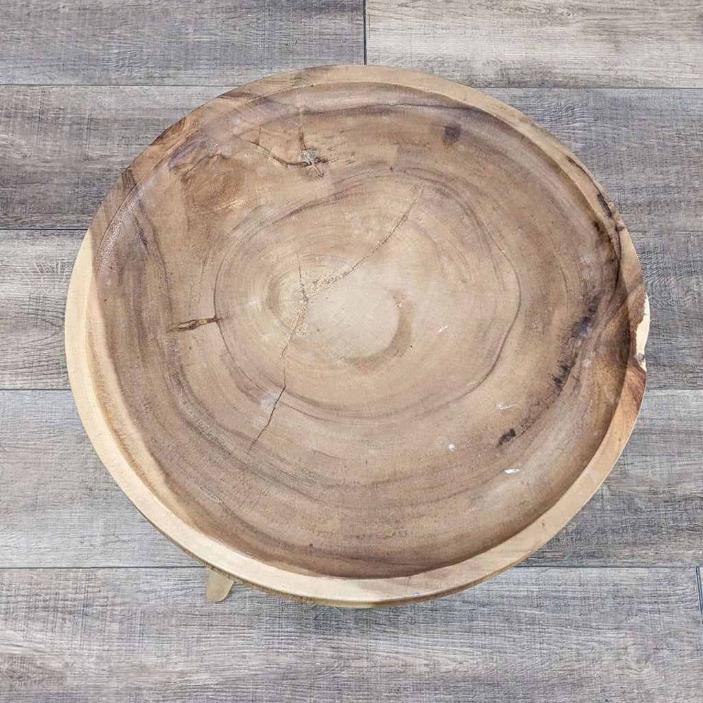 a wooden bowl with a circular cut out of it.
