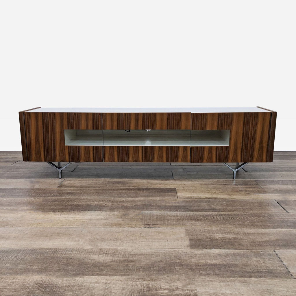 a walnut and walnut entertainment unit with a glass top.