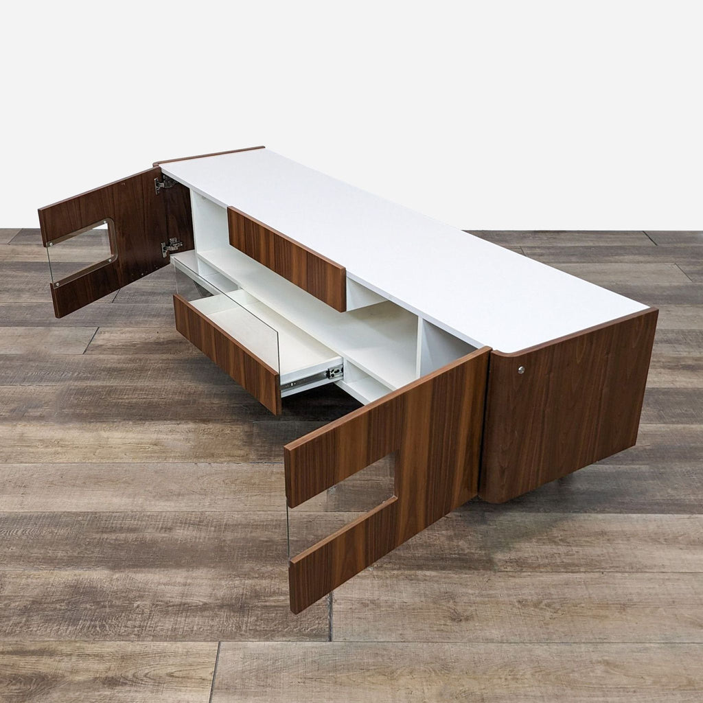 a modern office desk with a white top and a wooden base.