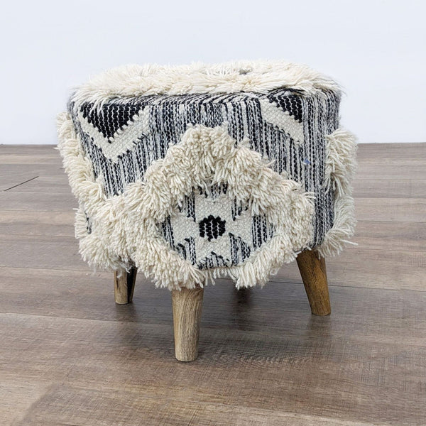 a black and white stool with a white and black pattern.