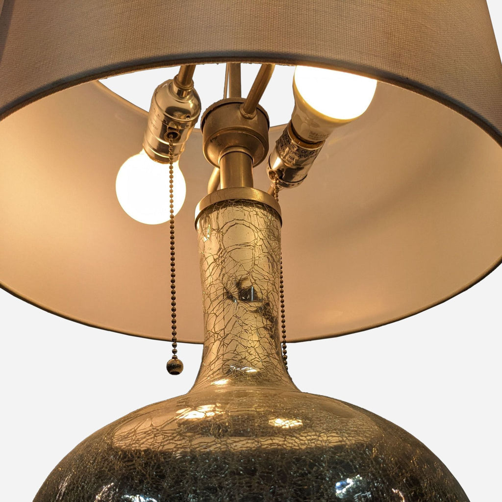 a vintage table lamp with a bronze base and a brass base.