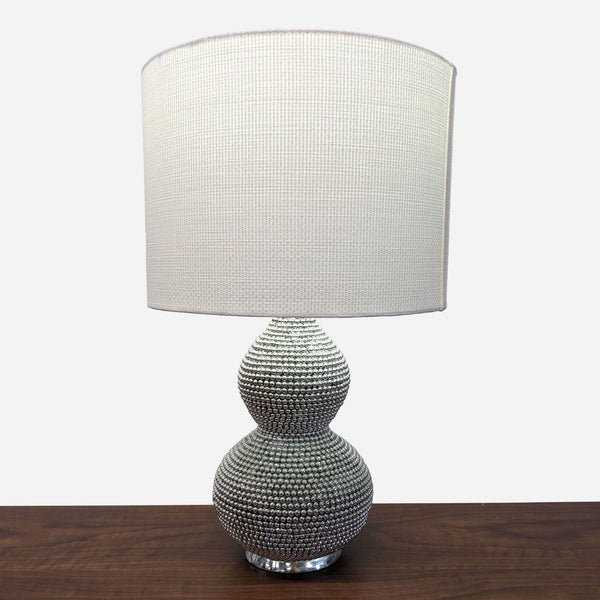 the modern table lamp with a white shade