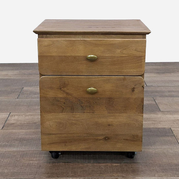a small chest of drawers with a wooden top