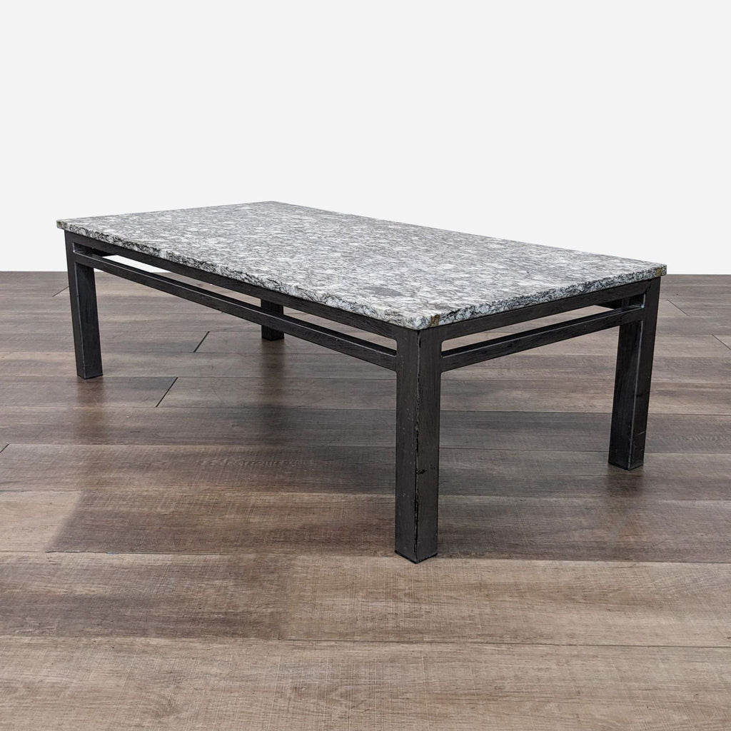 a coffee table with a marble top.
