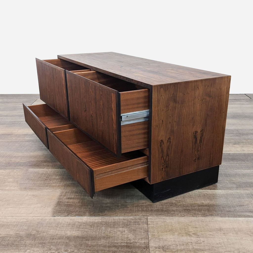 a mid century modern walnut and walnut sideboard.