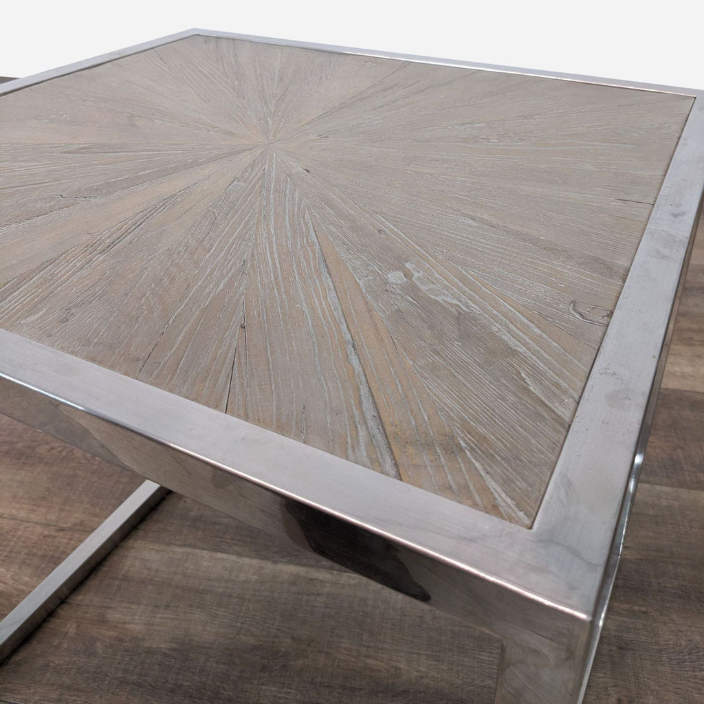 a large, polished steel coffee table with a large centerpiece.