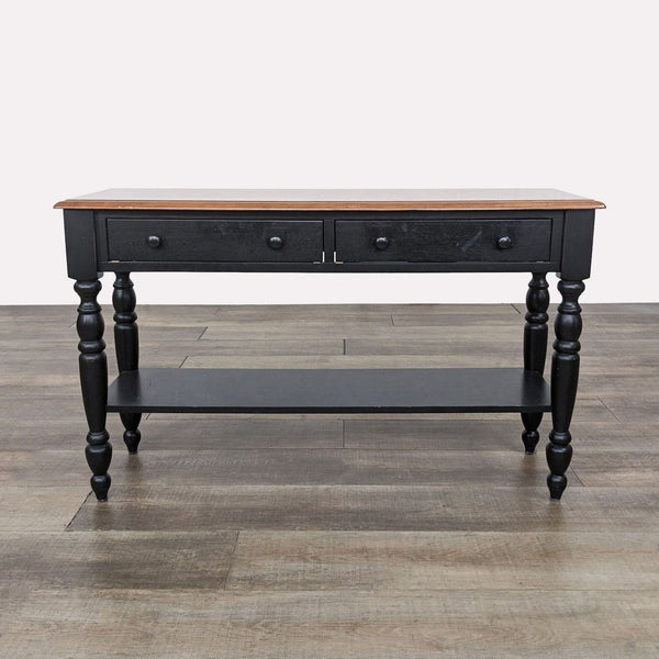 a black and brown console table with a black top and a wooden top.