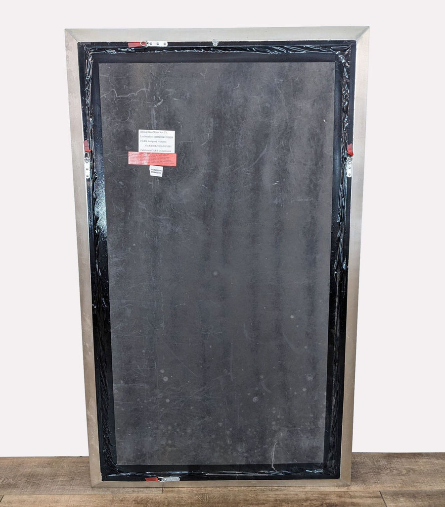 a large metal door with a black frame.