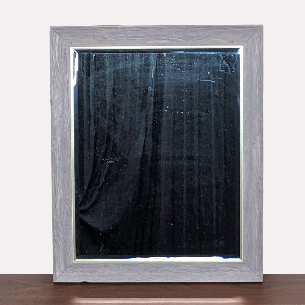 a mirror with a black curtain