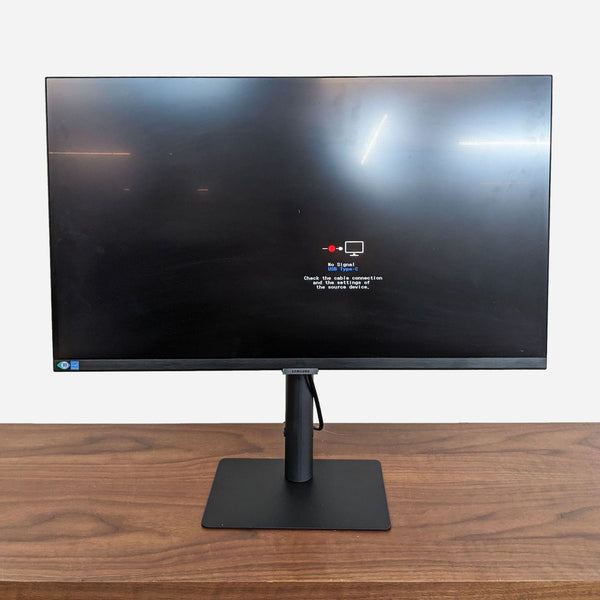 a large monitor on a desk.