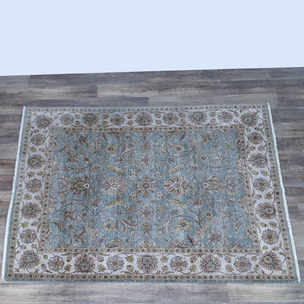 a blue and white oriental rug with a brown border.
