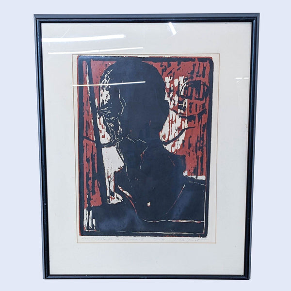 a framed print of a man with a cigarette in his mouth.