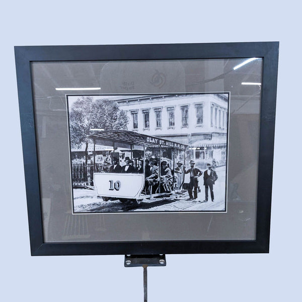 Framed print of a historic Clay St Railroad car, featuring passengers and period architecture.