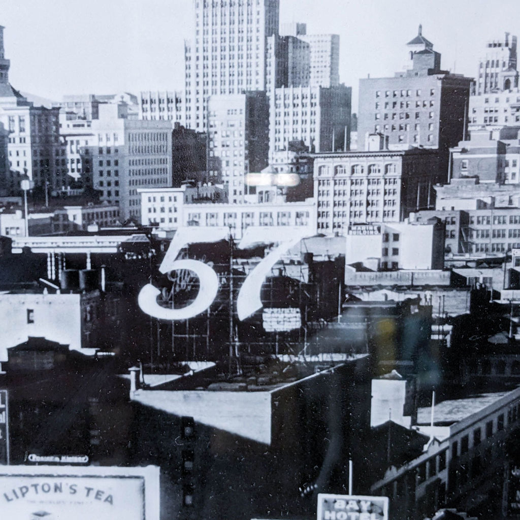Close-up of Market Street buildings with number 57 visible, c1920-30.