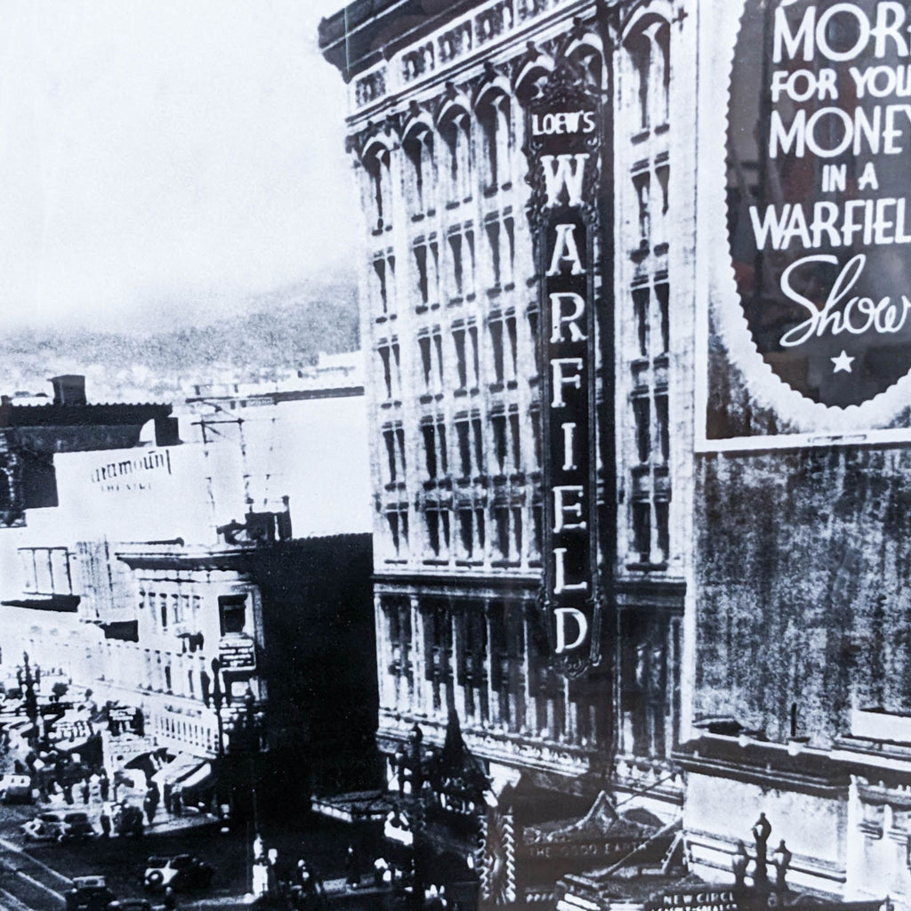 Close-up black-and-white image of historic Warfield building signage on Market St, San Francisco.