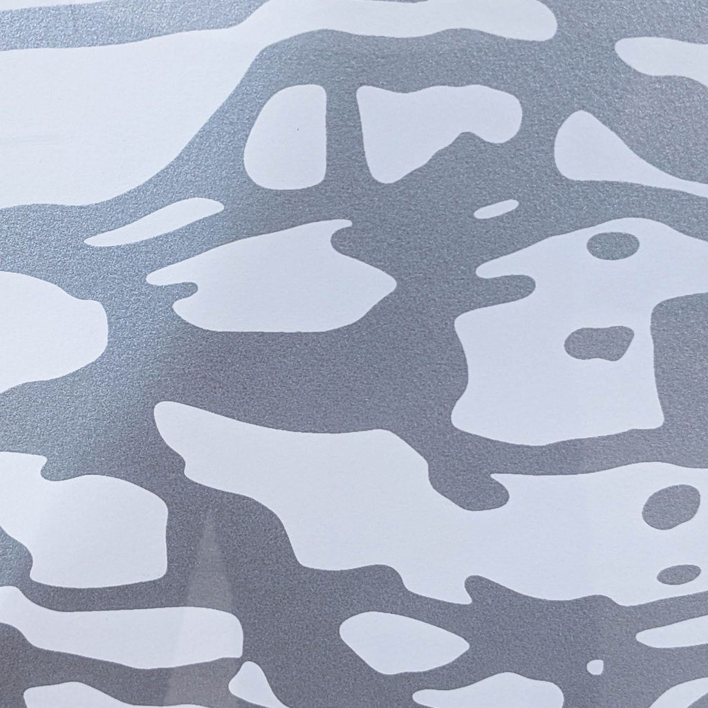 Close-up of abstract gray and white pattern from art print.