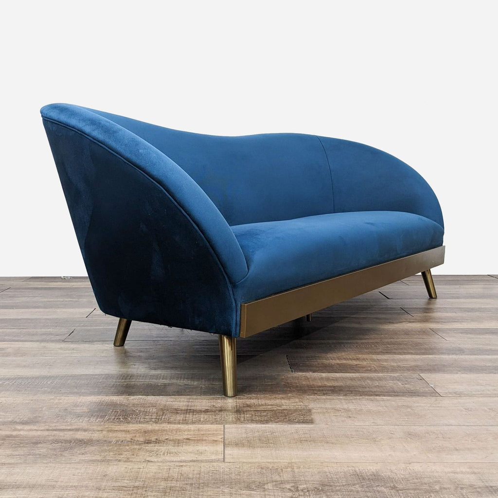 a blue velvet sofa by [ unused0 ]
