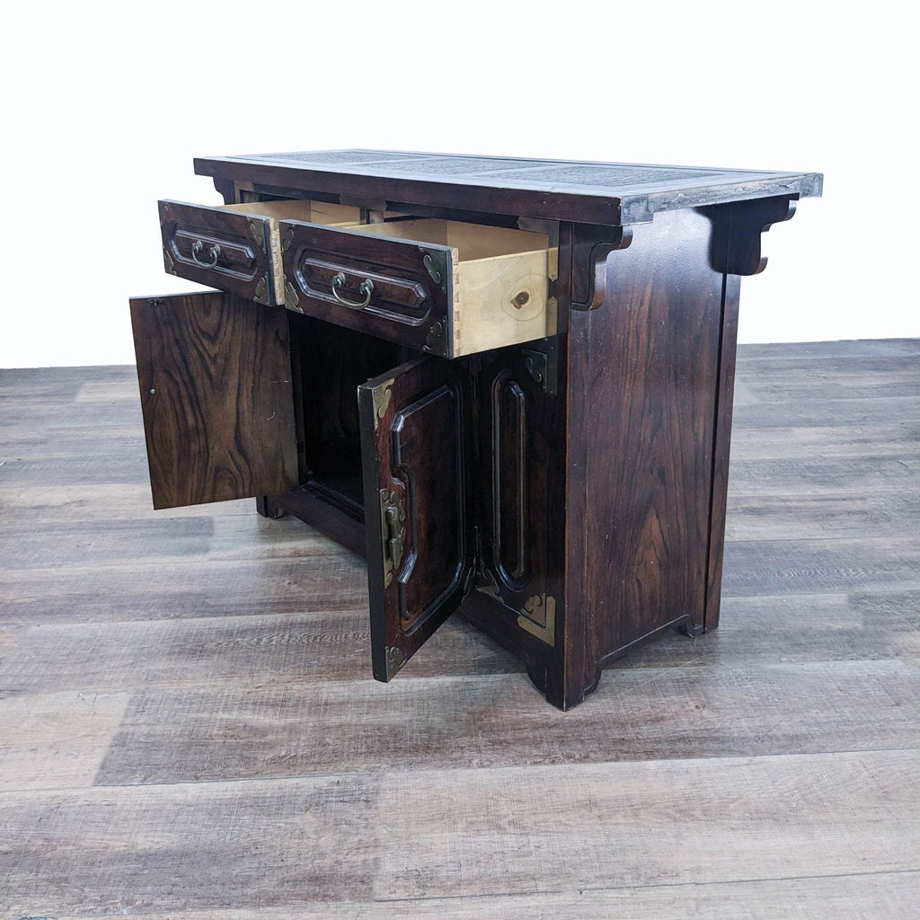 a vintage chinese tea table with drawers