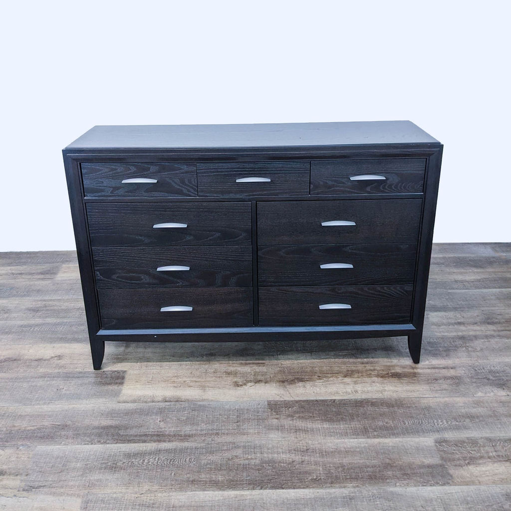 Front view of Reperch dresser, featuring modern silver handles.