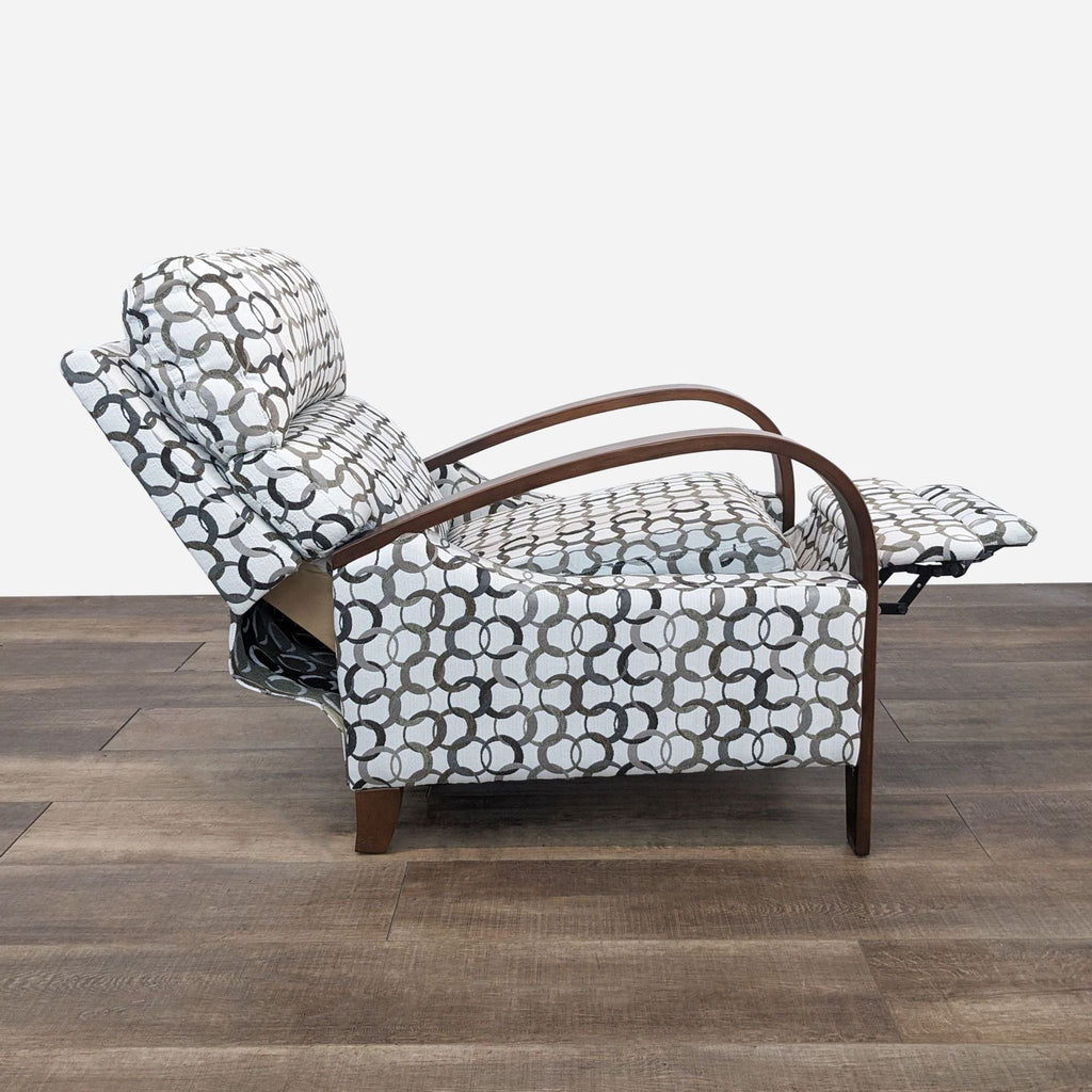 a lounge chair with a black and white pattern