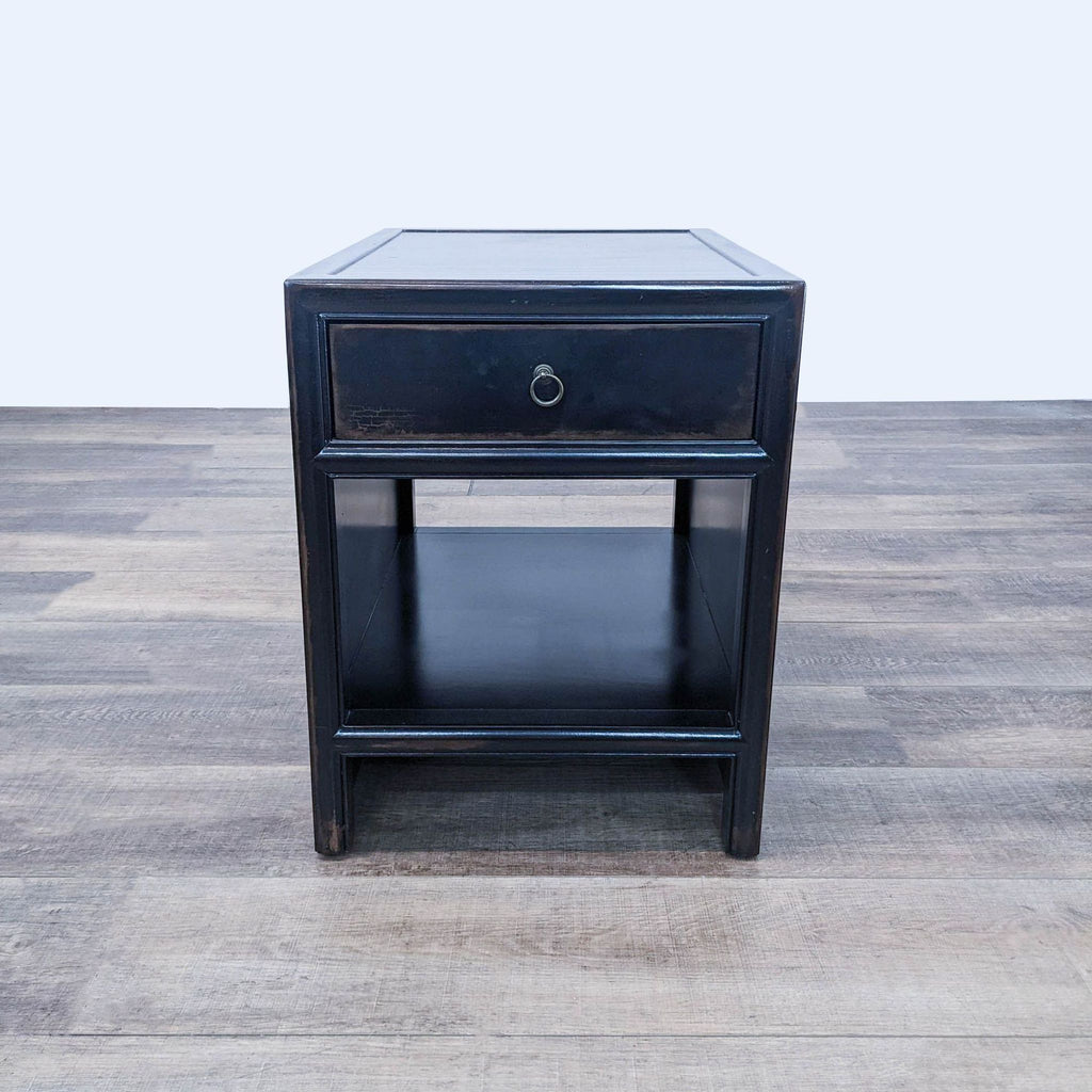a black side table with a glass top.