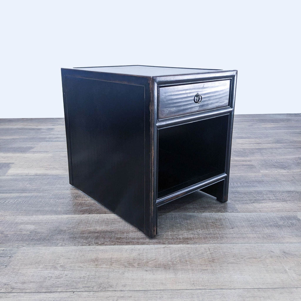 a black lacquered side table with a black lacquer finish.