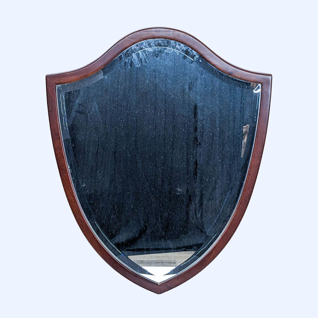 a vintage shield with a dark wood frame